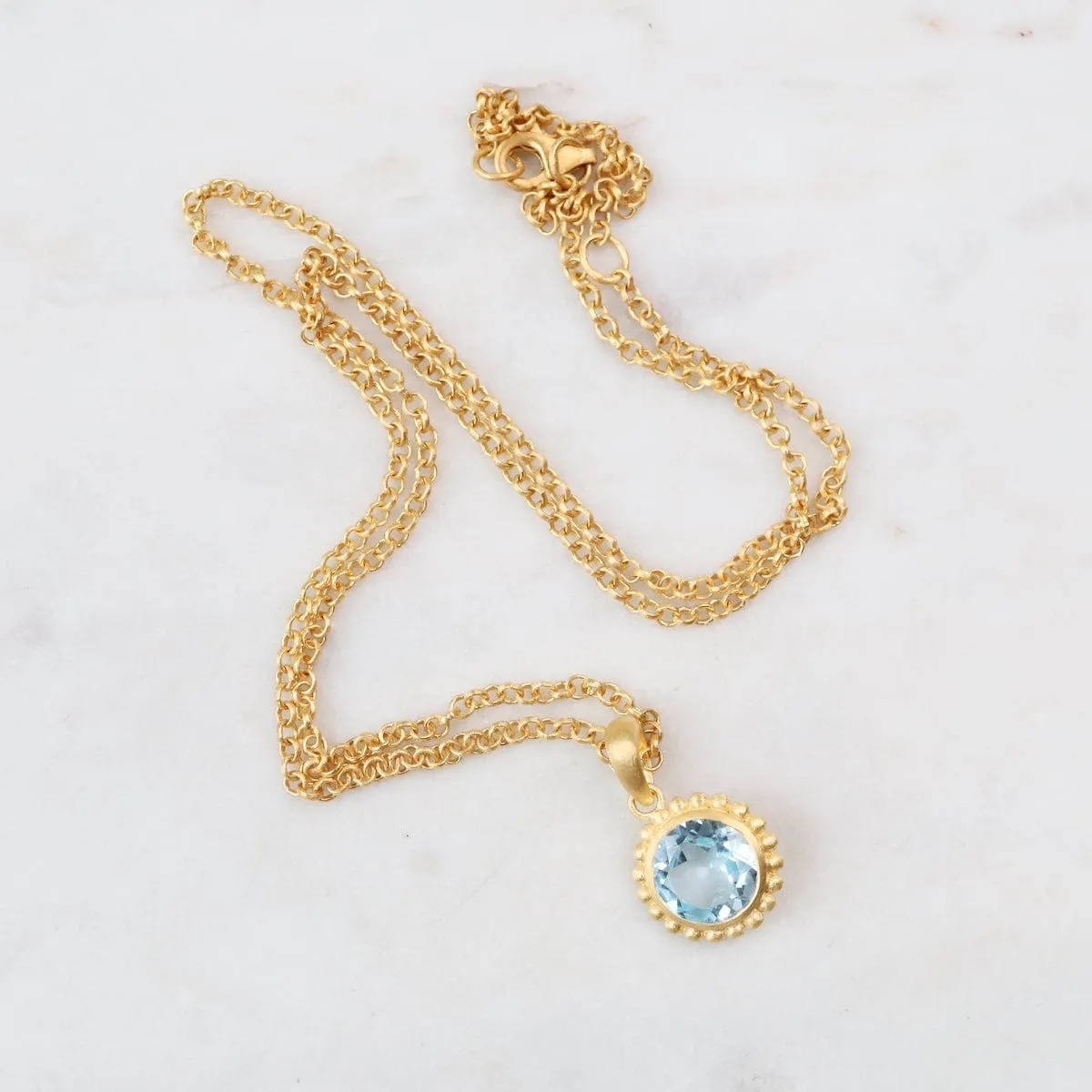 Karma Blue Topaz Pendant Necklace